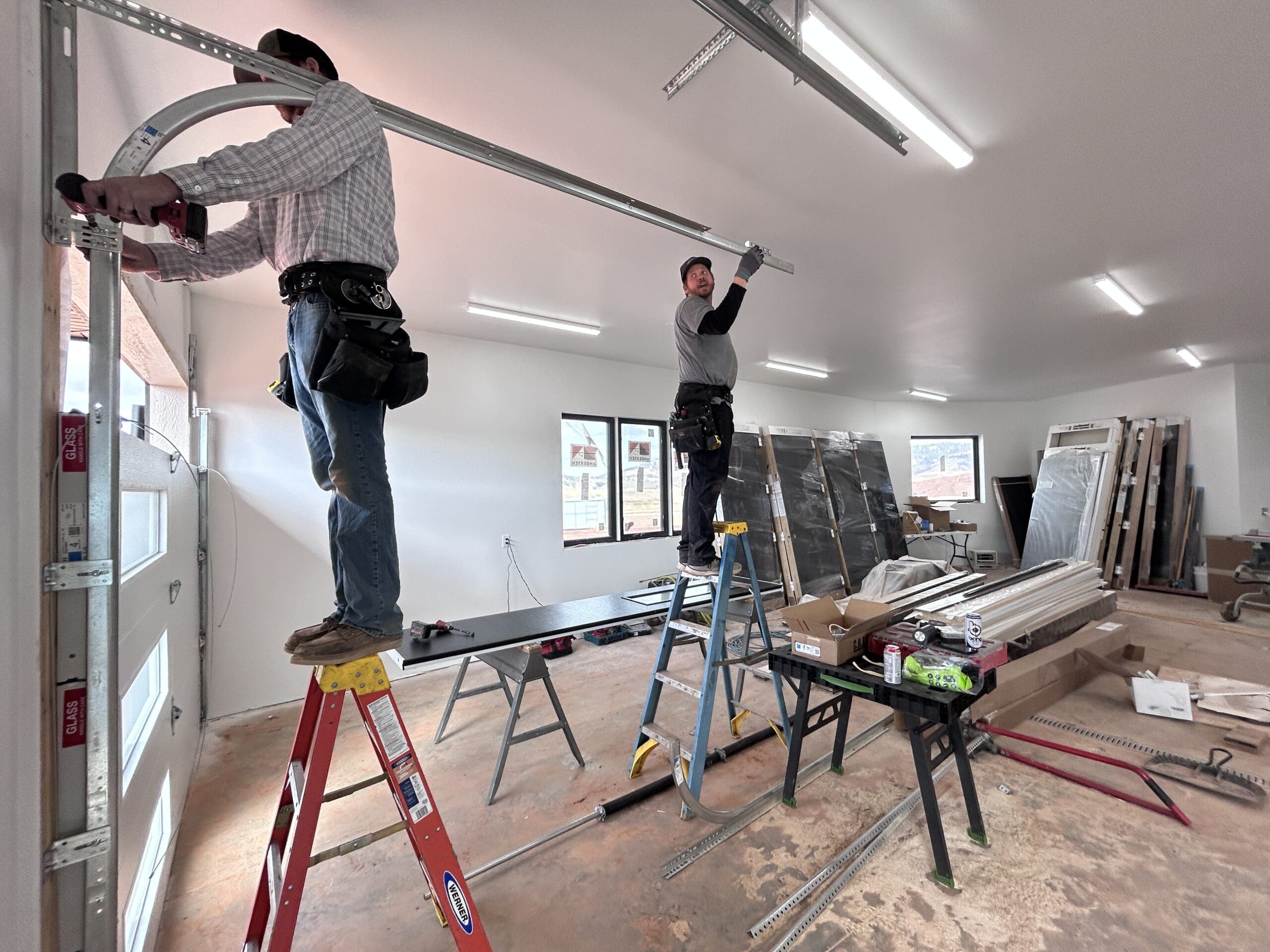 Odrix Media documents a garage door installation in progress by a professional installer in Spearfish, South Dakota, showcasing the business’s corporate look.